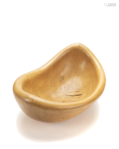 A carved maple free-form bowl