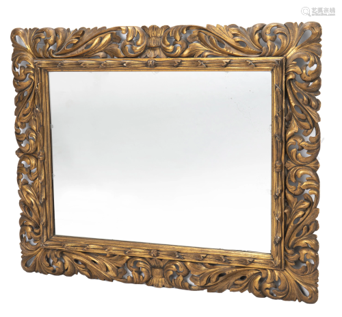 A carved and giltwood wall mirror