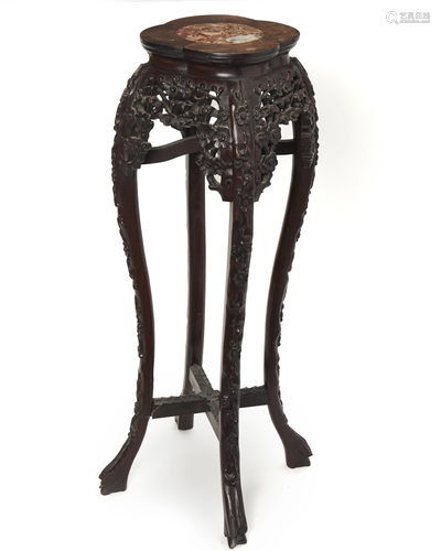 A Chinese carved wood stand