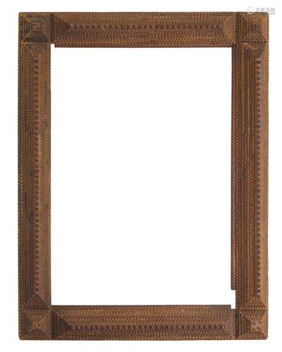 A chip-carved tramp art picture frame