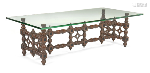 A Moroccan-style rectangular carved wood cocktail table