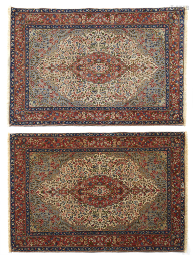 A near-pair of Persian rugs