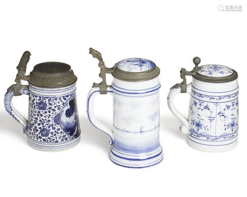 Three Delft-style steins