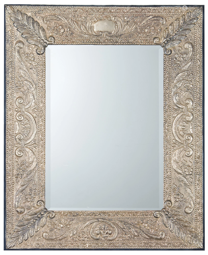 A Spanish-style hammered silver wall mirror