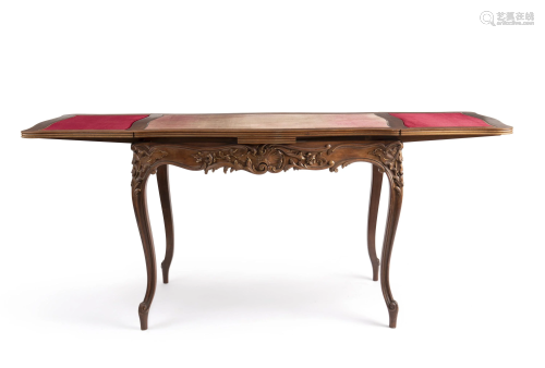 A Louis XV-style carved wood extendable table
