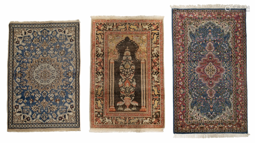 Three Persian-style rugs