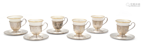 A set of sterling silver demitasse cups