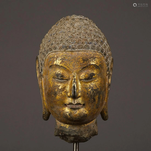 GILT-LACQUERED STONE HEAD OF BUDDHA