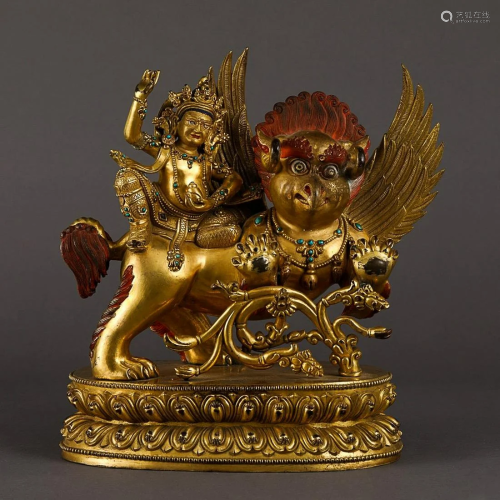 GILT COPPER ALLOY FIGURE OF BUDDHA AND BEAST