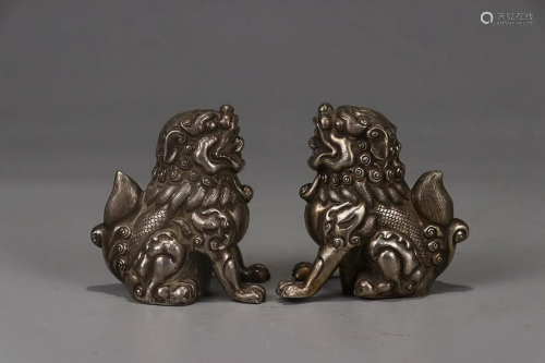 PAIR OF SILVER ORNAMENTS OF LION