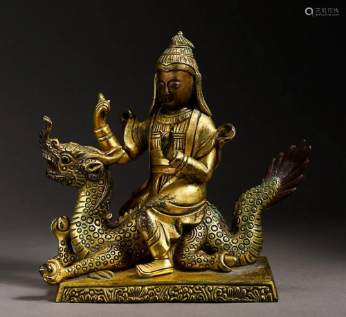 GILT-COPPER ALLOY FIGURE AND BEAST