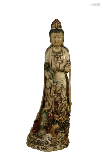 RARE MATERIAL FIGURE OF GUANYIN HOLDING LOTUS
