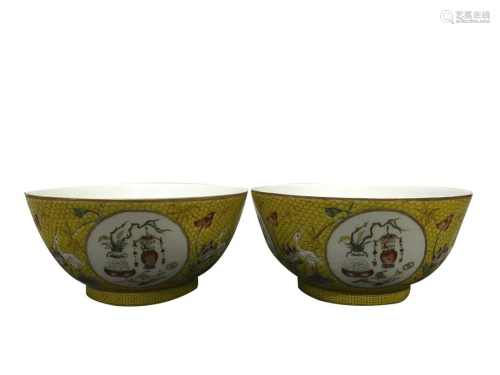 PAIR OF YELLOW GROUND FAMILLE ROSE 'FLORAL' BOWLS