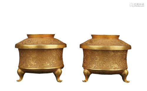 PAIR OF GILT COPPER ALLOY TRIPOD CUPS CAST WITH FLORAL