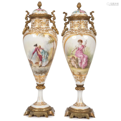 A Pair of Sevres-style Lidded Urns in White and Gilt