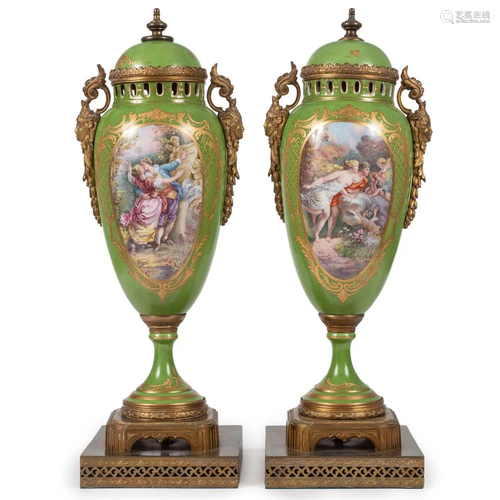 A Pair of Porcelain Urns in Green with Ormolu Mounts