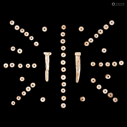 A Frame of Shell Disc Beads and Ornaments, Largest