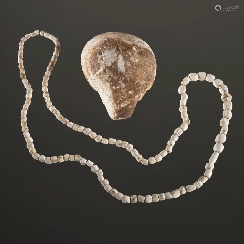 A Mississippian Shell Gorget and Shell Beads, Largest
