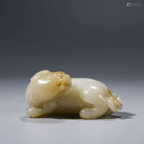 A CHINESE WHITE JADE RECUMBENT TIGER