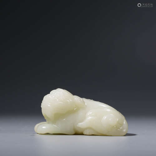 A CHINESE WHITE JADE RECUMBENT BEAST