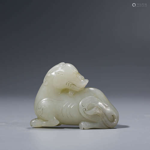 A CHINESE WHITE JADE RECUMBENT BEAST