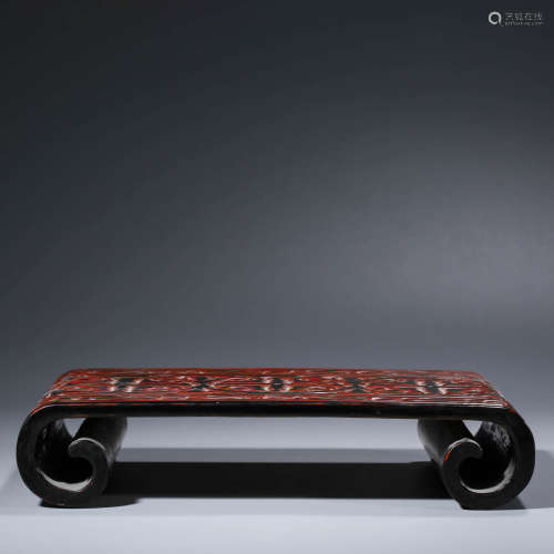 A CHINESE CINNABAR SCROLL-SHAPED STAND