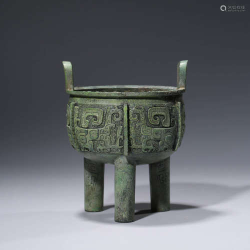 A CHINESE BRONZE TAOTIE MASK TRIPOT STEAMING VESSEL, DING