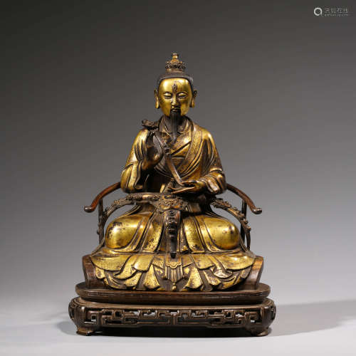 A CHINESE GILT-BRONZE  PRIMEVAL LORD OF THE HEAVEN STATUE AND STAND