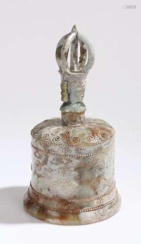 Carved stone bell with pierced figural finial and foliate decoration, 23.5cm high