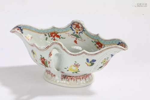 Chinese porcelain famille rose sauceboat, with foliate decoration and loop side handles