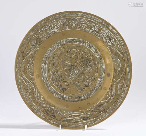 Chinese brass plate, decorated with dragons and a conforming border, the underside with a