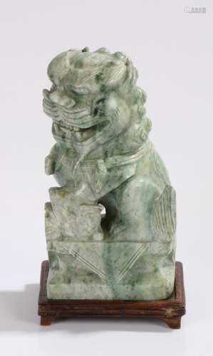 Carved soapstone dog of fo, on a hardwood stand, 23cm high