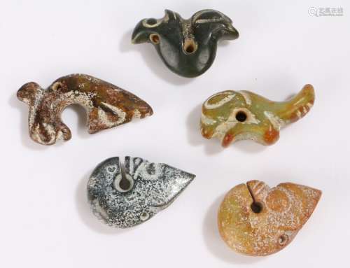 Collection of five Chinese pendants, each carved in hardstone with pieced holes, 60mm long up to