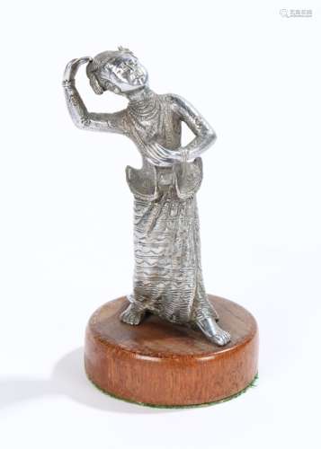 Chinese white metal statue, of a dancing figure on a hardwood stand, 13cm high