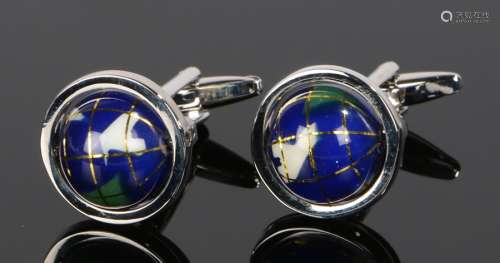 Pair of cufflinks, with a pair of swivel globes to the heads