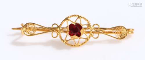 Gold coloured metal brooch set with red paste, 1.9g