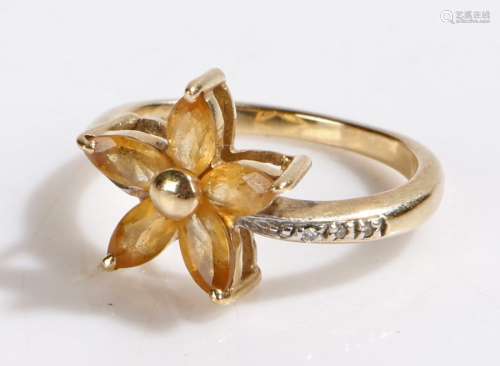 9 carat gold ring, with five oval yellow stones set in a star formation, ring size L1/2, 3.2g