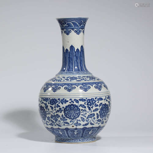 A CHINESE BLUE AND WHITE PORCELAIN FLOWER AND SEA WAVE VASE MARKED QIAN LONG