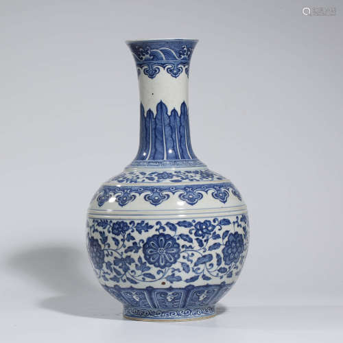 A CHINESE BLUE AND WHITE PORCELAIN FLOWER AND SEA WAVE VASE MARKED QIAN LONG