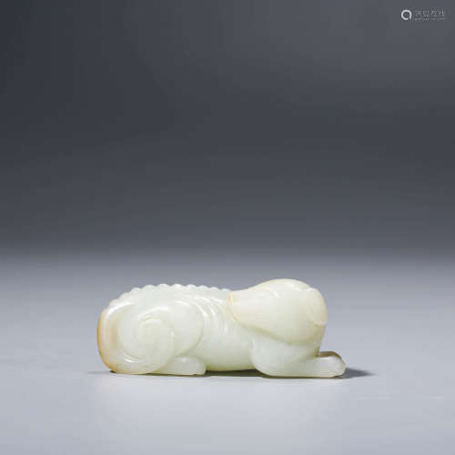 A CHINESE WHITE JADE RECUMBENT DOG