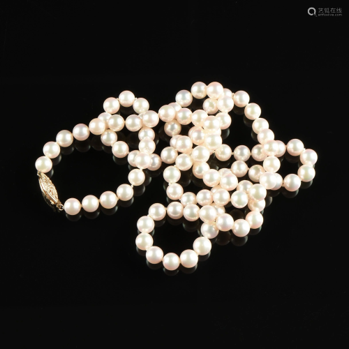A 14K YELLOW GOLD AND PINK PEARL MATINEE LENGTH