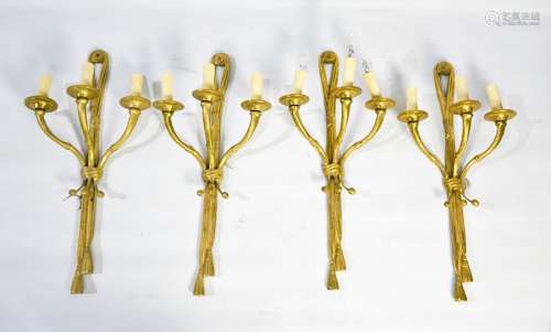 A set of four 19th century style French brass wall lights, each with triple cornucopia form