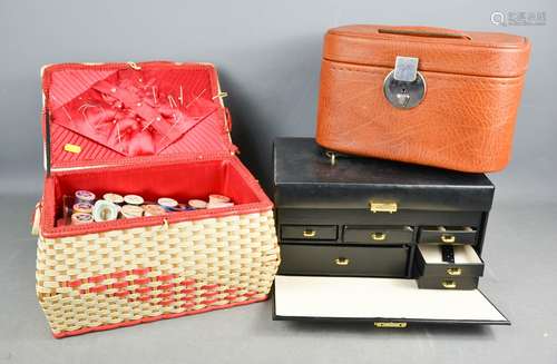 A sewing case with contents to include sewing accessories, and two vanity cases.