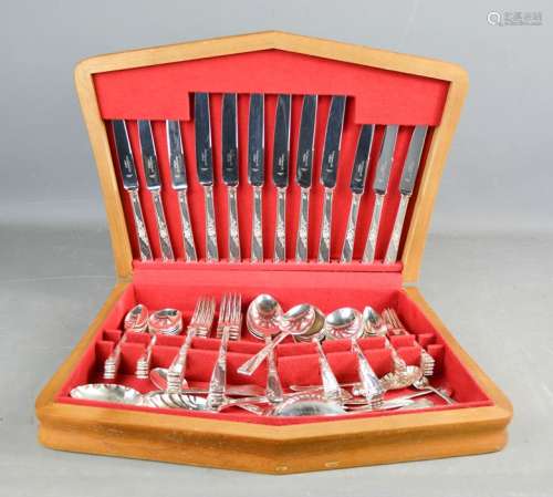 A silver plated canteen of cutlery, with red lined interior.