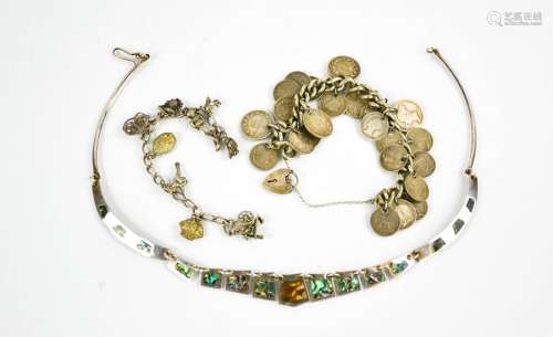 A mother of pearl and silver necklace, a charm bracelet and a silver chain link bracelet with
