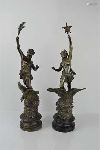 A pair of spelter 19th century figures with eagles at their feet, raised on socle bases.50cms tall x