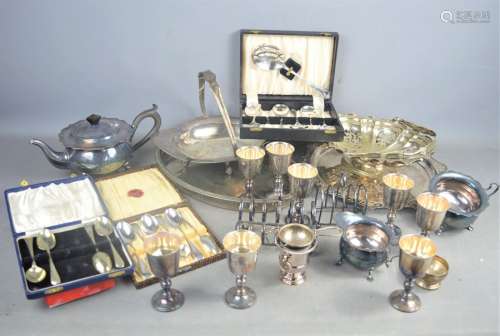 A quantity of Silver-plate to include boxed flatware , toast racks , teapot etc