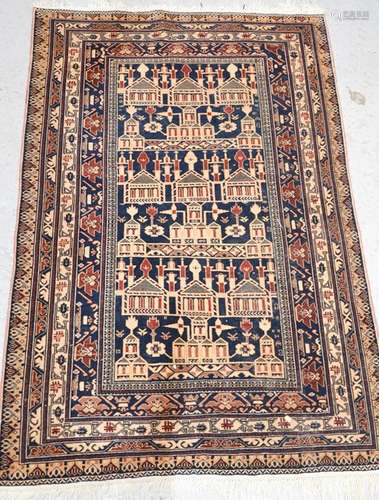 A middle Eastern blue ground wool rug with architectural pattern 98cm x 146cm