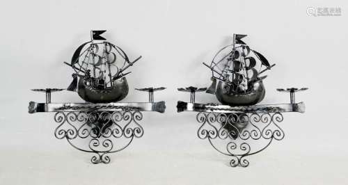 A pair of painted iron wall lights, in the form of ships. 30cms x 28cms