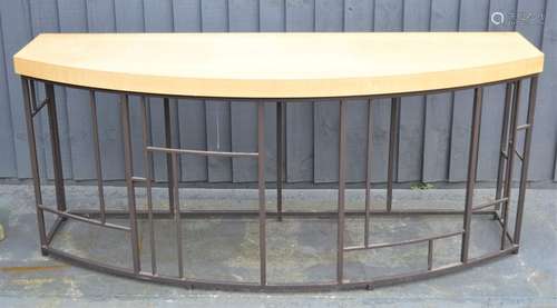 A large metal and wood side table in the style of David Linley